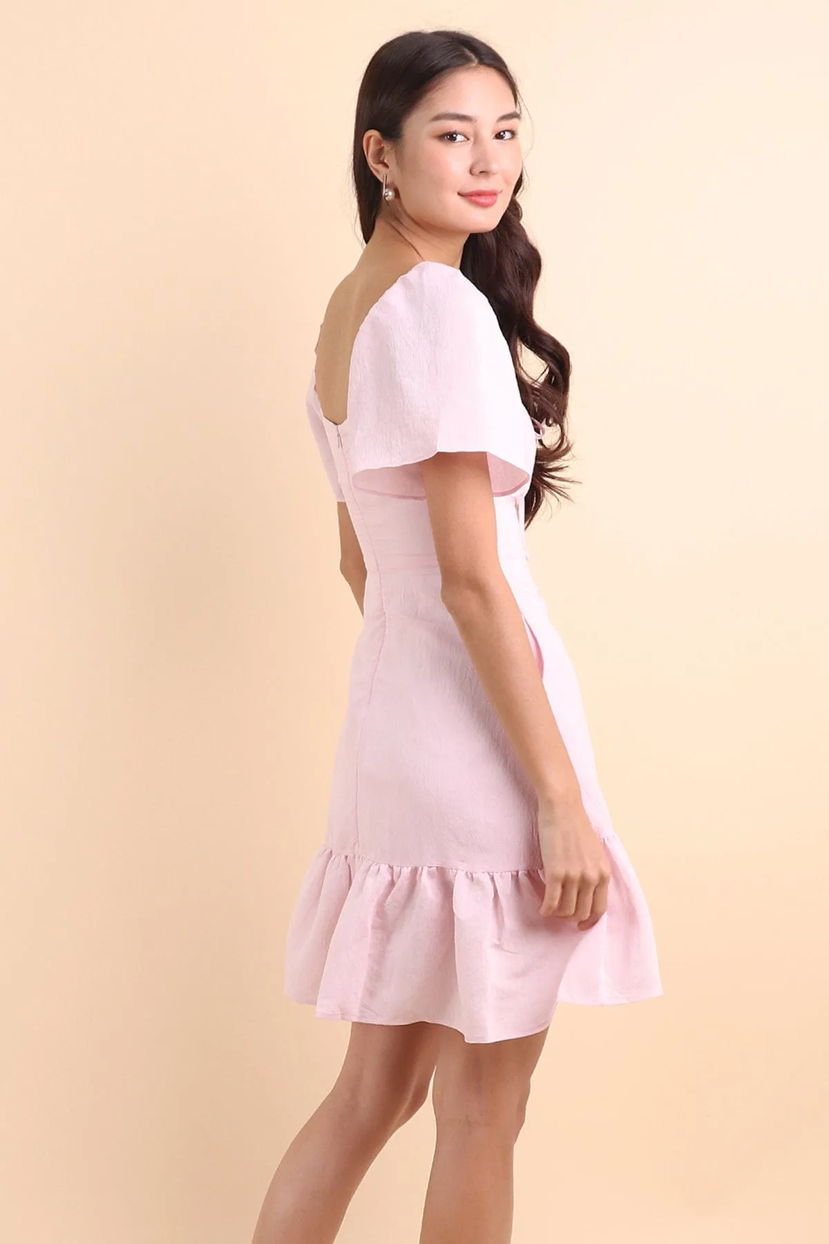 KHELSIE RUCHED FLUTTER SLEEVE ROMPER DRESS IN SWEET PINK