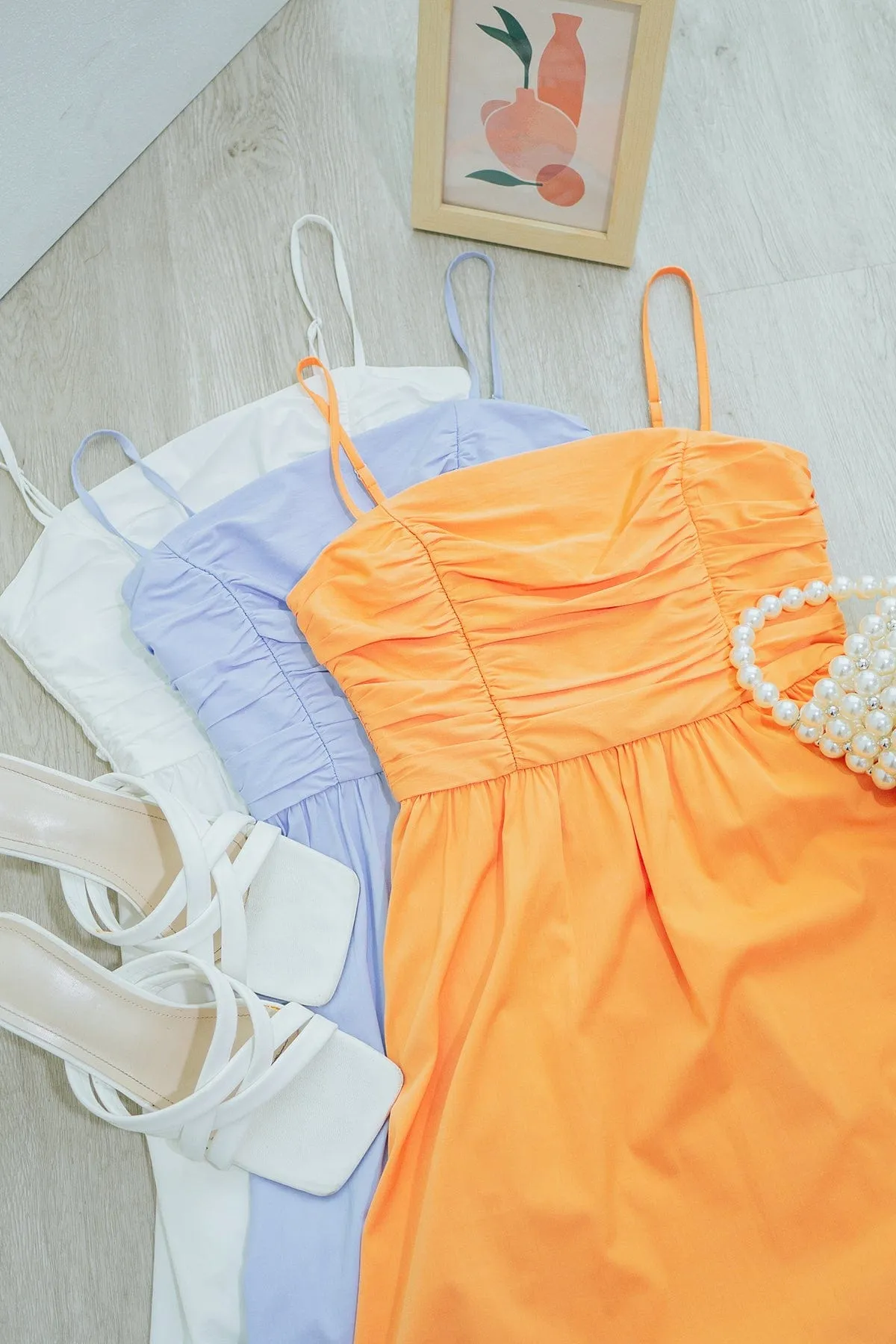 LOLA SLEEVELESS RUCHED ROMPER DRESS IN PERI BLUE
